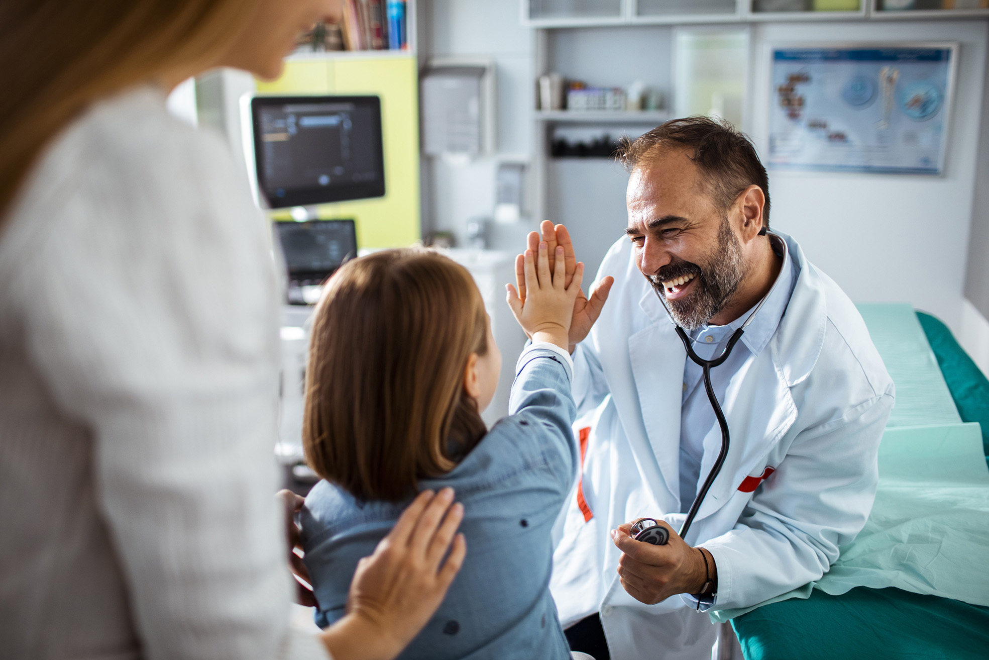 Close up of a doctor using a stethoscope to check up on his patient